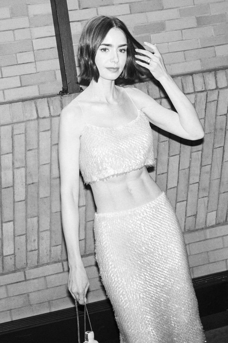 <p style="line-height: 20px; text-align: left;"><span style="font-family: 'Klein Web 55 Regular'; color: #ffffff; font-size: 14px; letter-spacing: 0.3px;">Lily Collins</span></p>